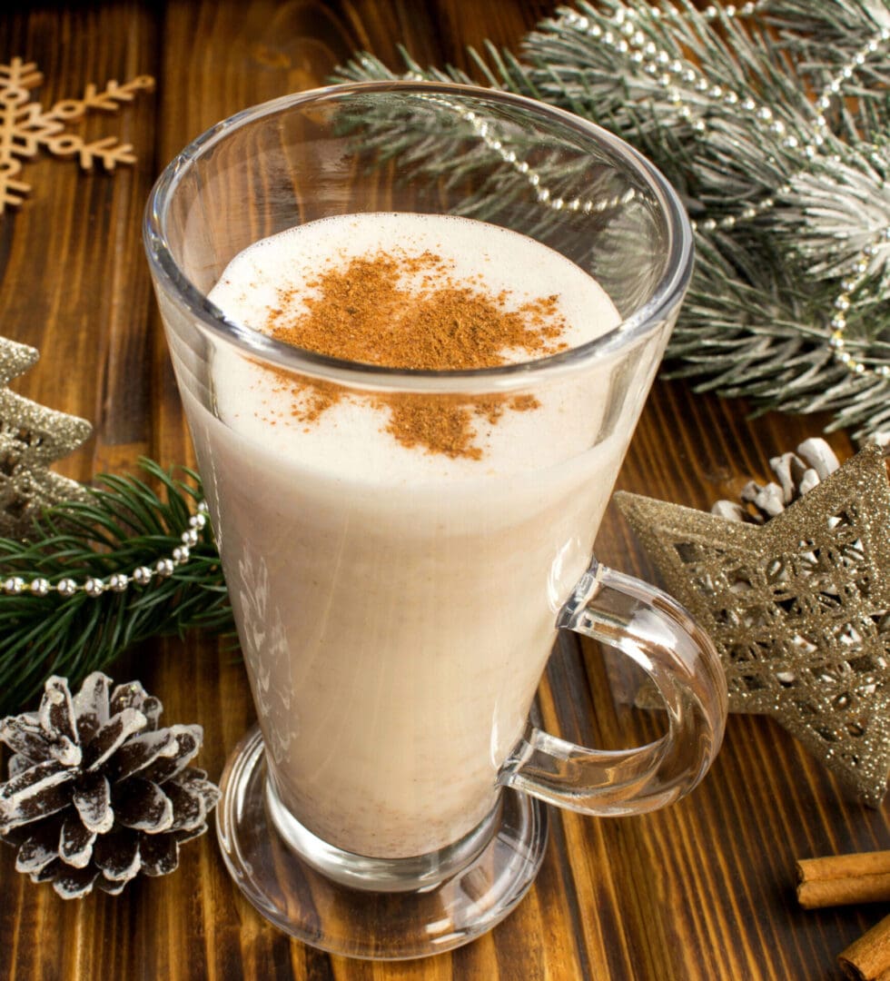 Eggnog with cinnamon in a glass.