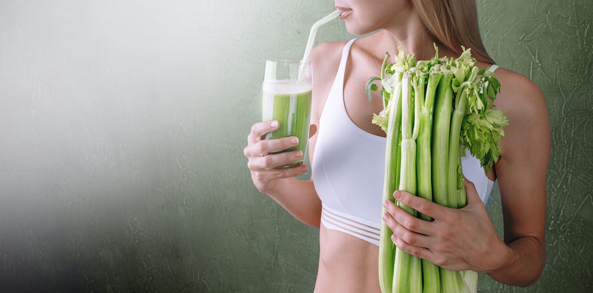 Woman drinking green celery juice.