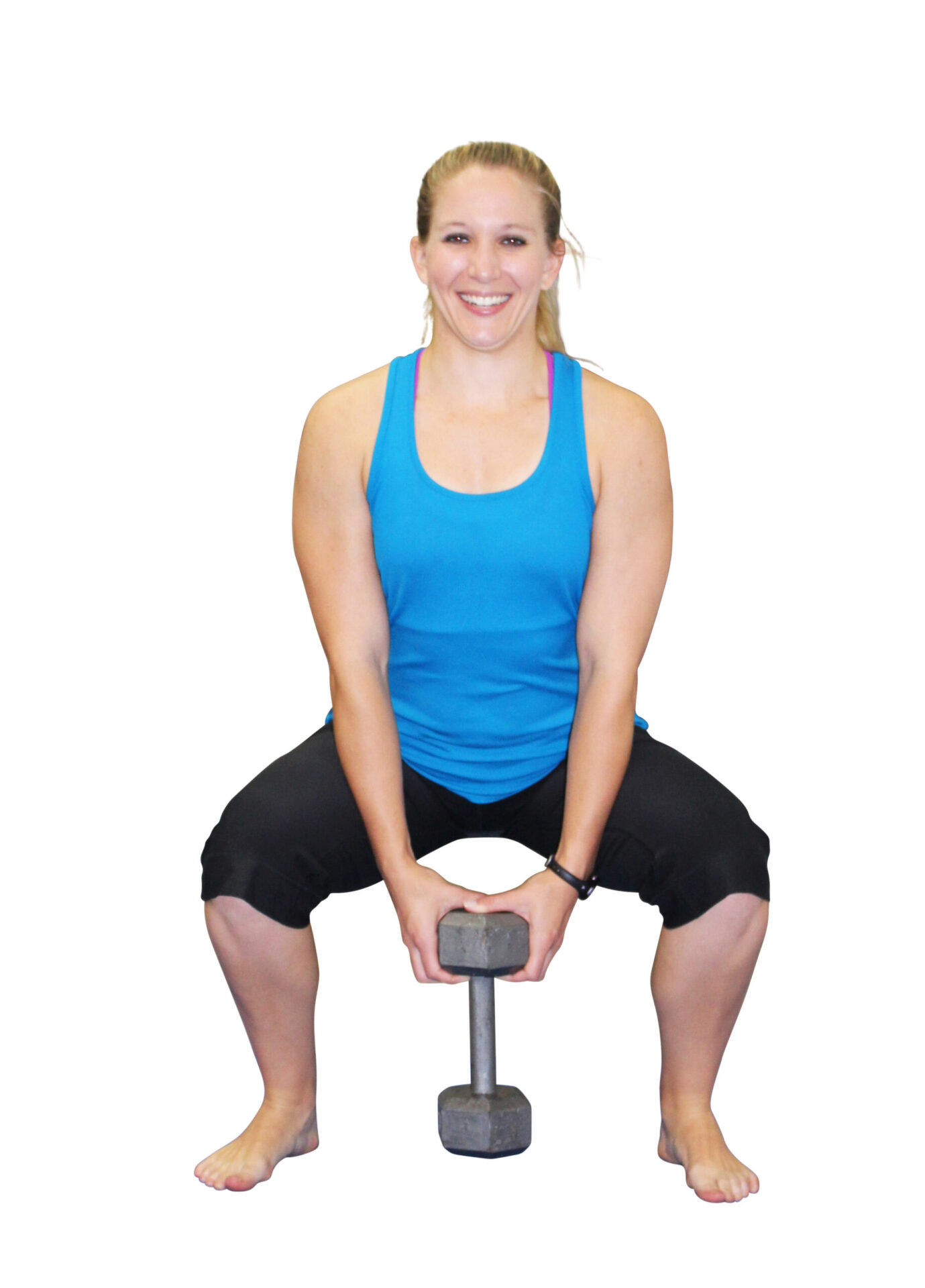 Woman squatting with dumbbell in hand.