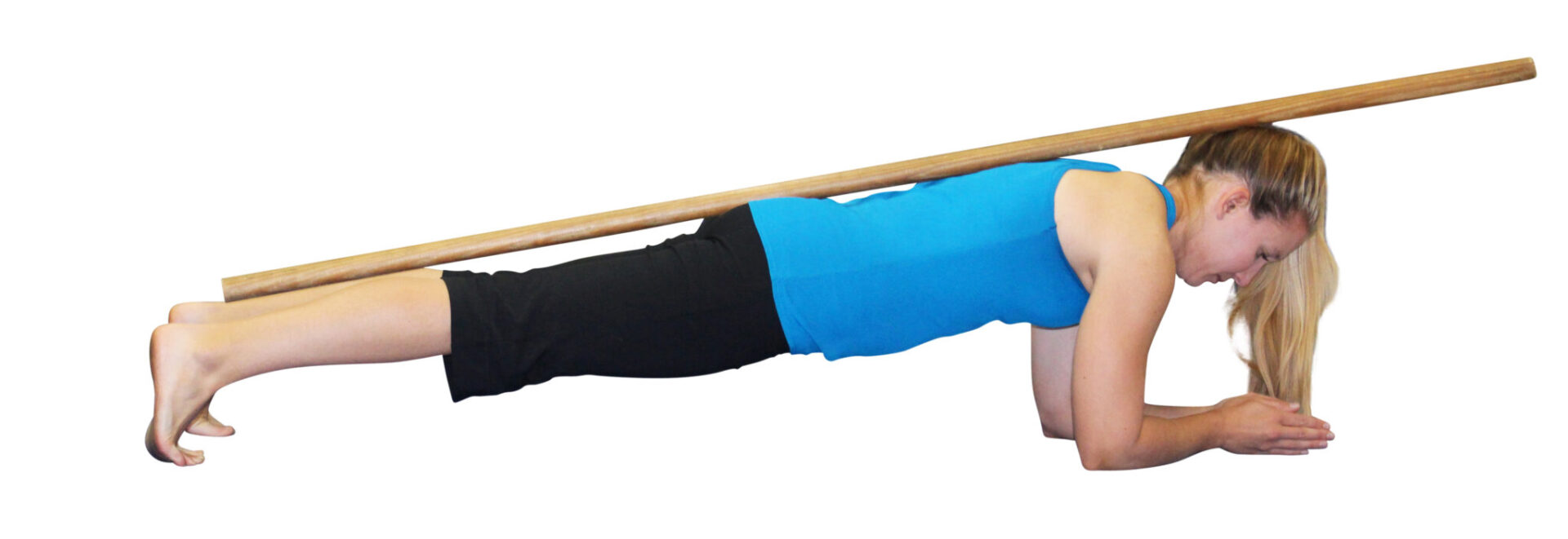 Woman doing a plank with a stick on her back.