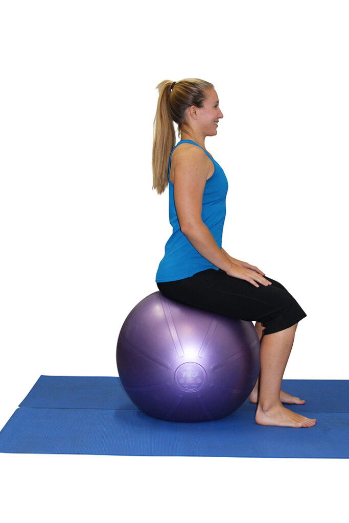 Woman sitting on an exercise ball.