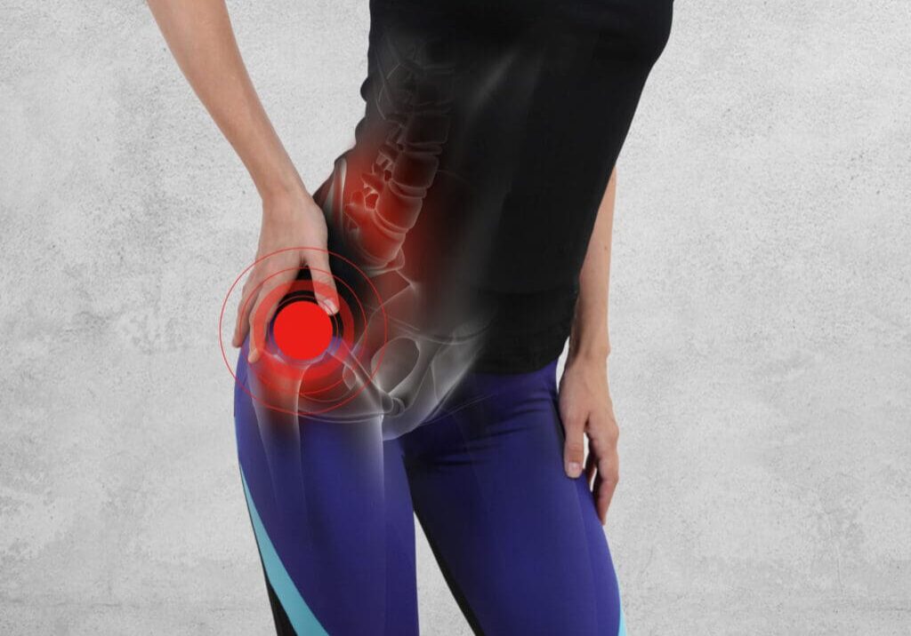 A woman holding her hip with the red object in front of her.