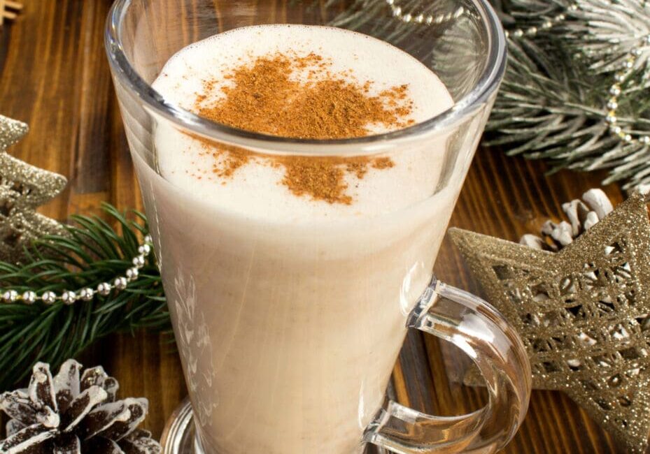 Eggnog with cinnamon in a glass.