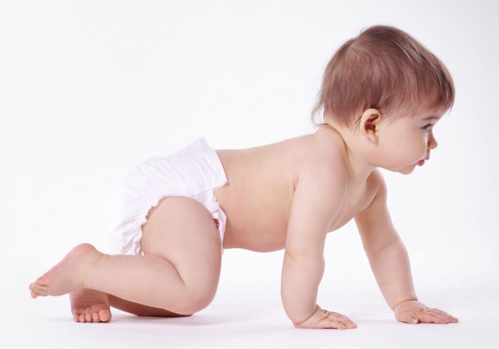 Baby crawling on white background.